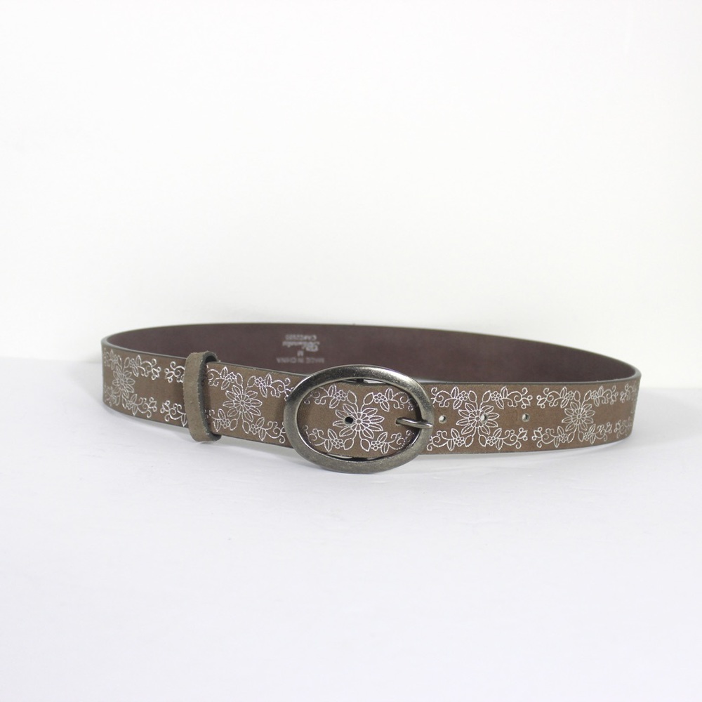 Beige Sueded Belt with Silver Embossed Floral Pattern and an Oval Silver Buckle